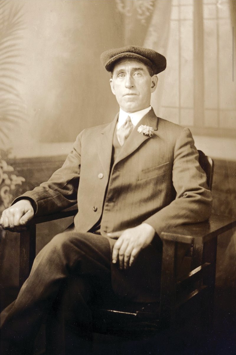 Bartholomew Joseph “Barthly” Molloy, in the traditional flat cap, appears in an undated studio photograph.